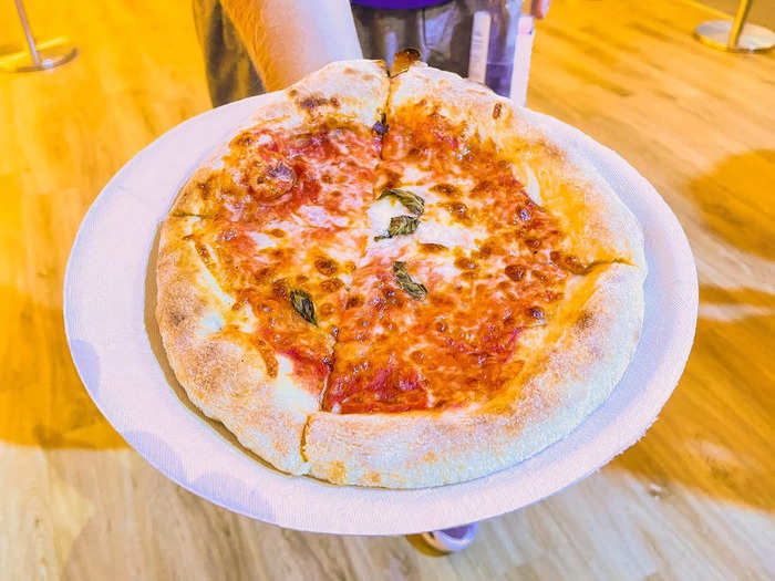 As I walked around the grounds, I saw a lot of people were also eating the $18 personal margherita pizza from San Matteo ...