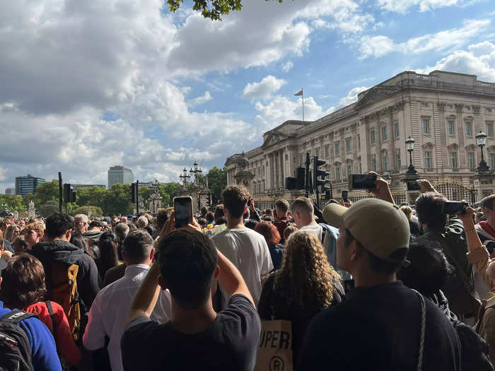 It was difficult to move an inch in front of Buckingham Palace. Everywhere was jam-packed with people waiting with flowers and those hoping to catch a glimpse of Charles.