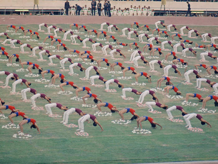 Celebrations funded by the government were also launched throughout the country to honor the Persian roots of Iran. Here, gymnasts take part in an October 16, 1975, celebration honoring the founding of the Persian Empire.