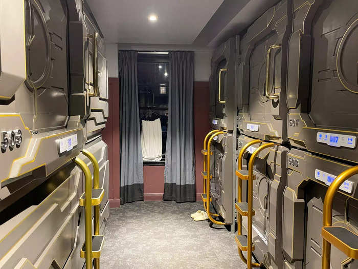 I found the door with my bed number and stepped inside. My pod was private, but located in a shared room with 11 other capsules where guests could dry towels, store shoes, and stretch since most people aren