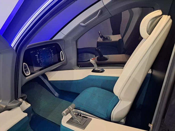 The cockpit is separate from the passenger seats.