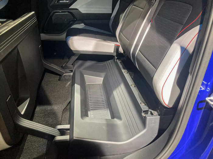 Some bonus storage nooks are concealed below the rear seats.