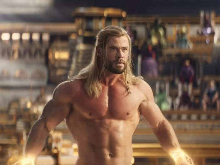 Zeus tethers Thor to the floor via lightning shackles and removes his disguise, accidentally leaving the superhero completely naked.