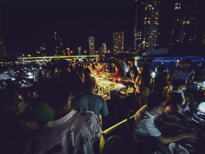 As soon as the ship took sail, the lines at the buffet grew even longer. People were grabbing tongs and heaping food onto their plates.