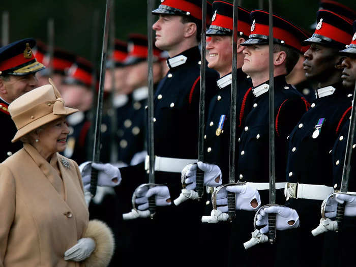 Queen Elizabeth made Prince Harry crack a smile at a military parade in 2006.