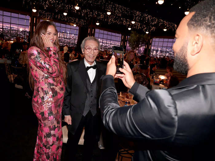 John Legend snapped a picture of his wife, Chrissy Teigen, and "Squid Game" actor Oh Yeong-su, who was nominated for outstanding supporting actor in a drama series.