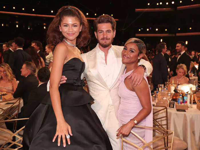 "Spider-Man: No Way Home" costars Zendaya and Andrew Garfield reunited during the event, posing for a photo with "West Side Story" star Ariana DeBose.