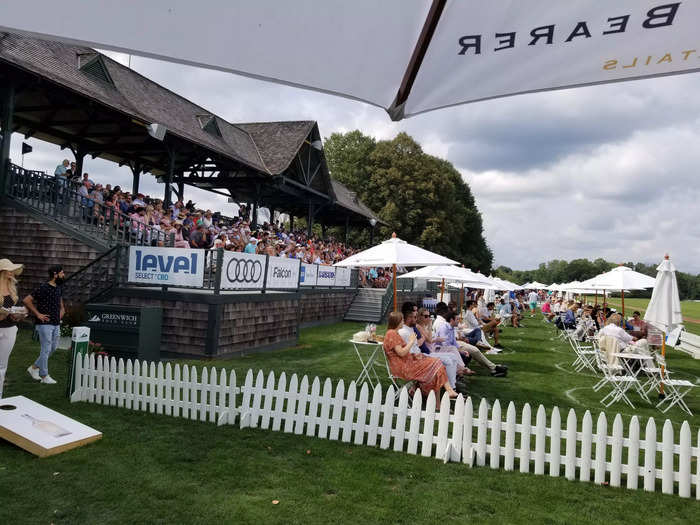 The Grandstand is at the center of the field and I think it has easy access to food, bathrooms, and everything else on the West Lawn.