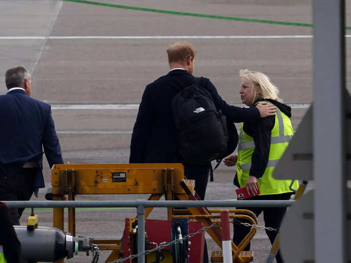 Prince Harry seemed to share a tender moment with an air-traffic controller the day after his grandmother died.