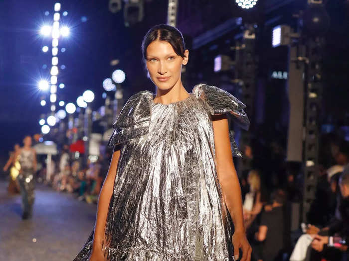 Behind her was Bella Hadid in a wild, metallic ball gown.