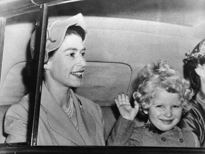 As they returned to London from vacation in 1954, the mother-daughter duo smiled and waved at the cameras.