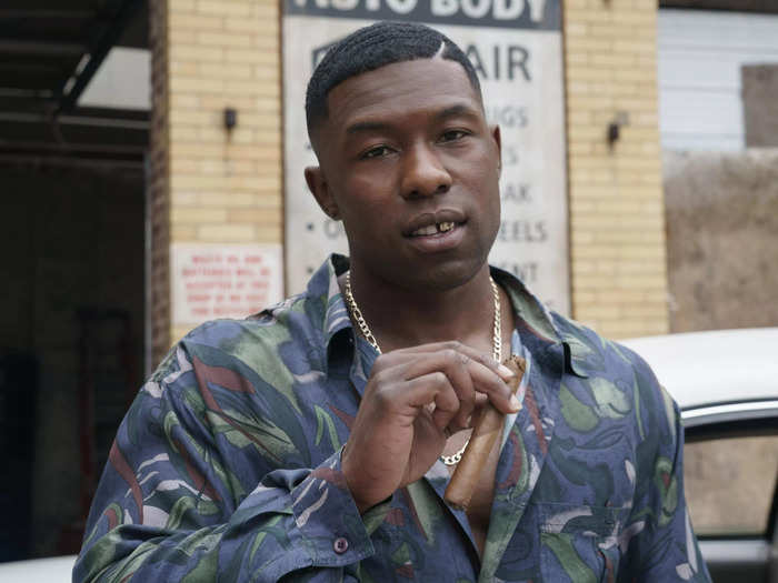 Trevante Rhodes wears a clean-shaven face, silky shirts, and shiny chains to play Mike Tyson.