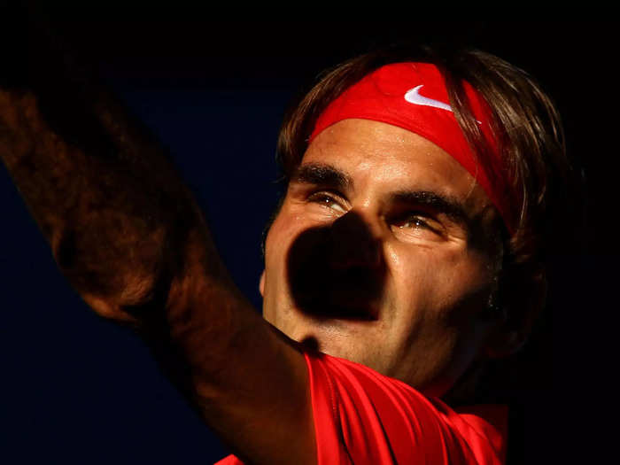Federer still manages to serve into the sun.