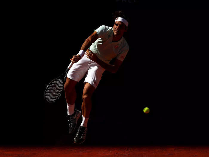 Federer serves out of the shadows at the 2019 Madrid Open.