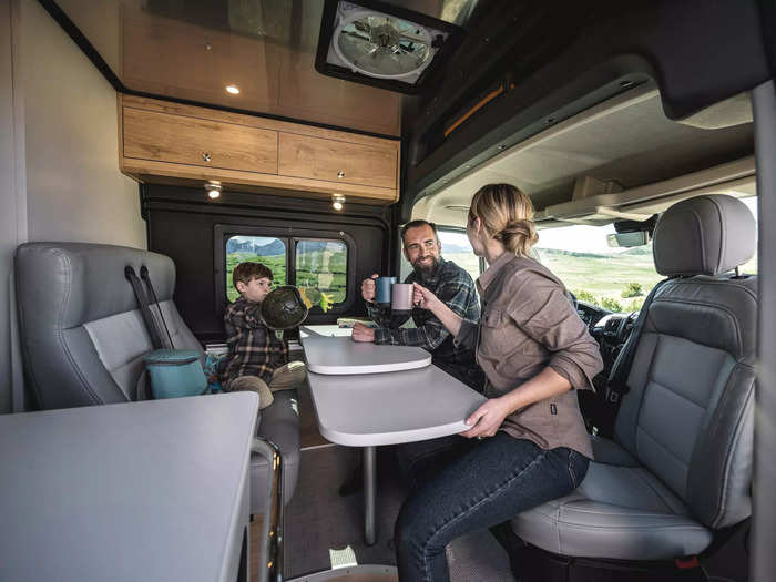 … and an expandable table that can be used when the driver and passenger seats are swiveled to face the table and two-person bench.