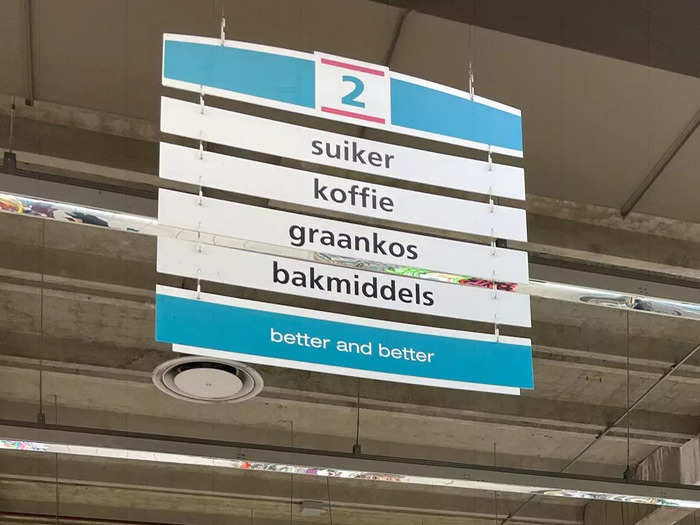 Signs in South African grocery stores have words in both English and Afrikaans.