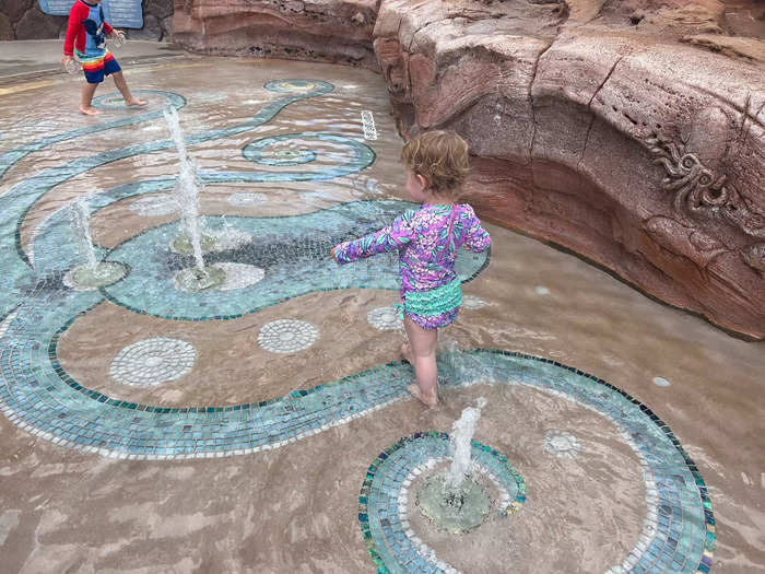 While my daughter loved Menehune Bridge, there were lots of kids running around, nearly knocking her over. My husband and I preferred she play in Keiki Cove, a smaller splash pad for young children with water jets inspired by tidal pools