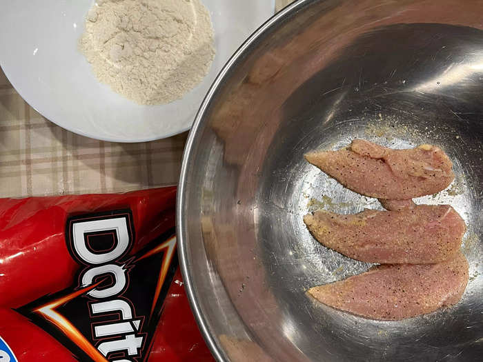 After my Doritos "breadcrumbs" were done, I put those aside and started seasoning the chicken.