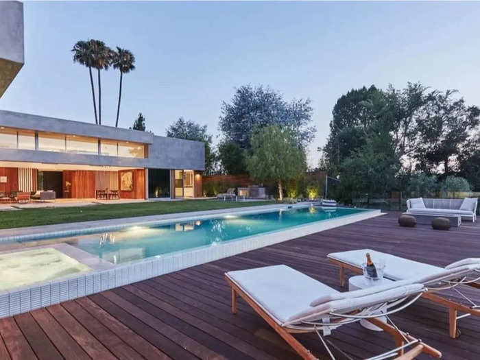 The pool has a large, simple deck with a jacuzzi. Here you can see back into the great room.