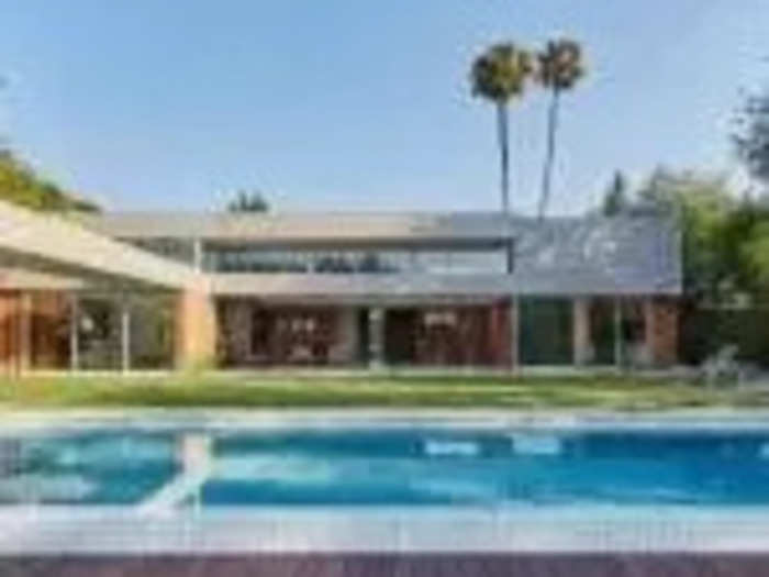 The property has two signature LA palms that rise above the house.