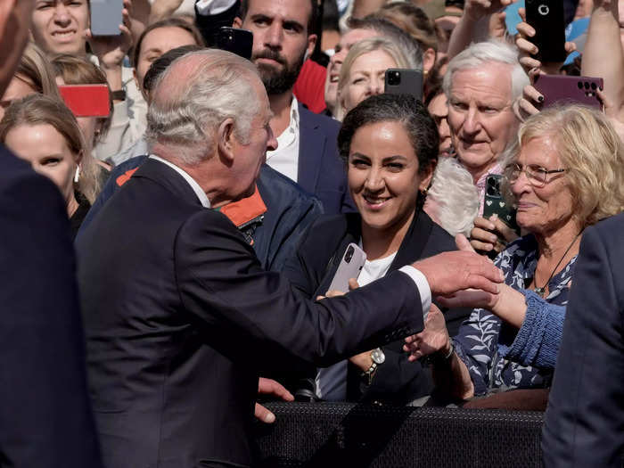 King Charles III shook hands with mourners outside Buckingham Palace one day after Queen Elizabeth