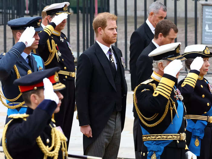 Prince Harry and Prince Andrew stood at attention as the rest of the royal family saluted the Queen.