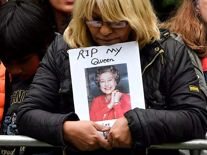 Some mourners carried signs made for her Majesty.