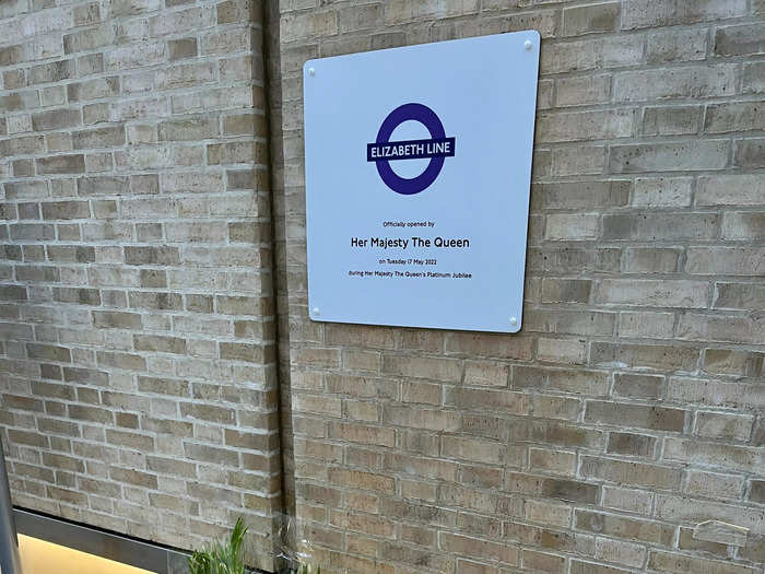 Flowers, cards, and handwritten notes sending wishes to the royal family had been placed under the official opening plaque in the station.