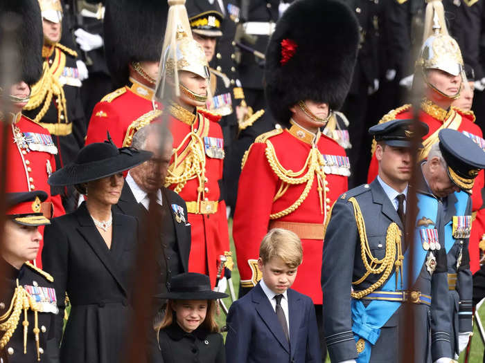 Charlotte and Kate held hands as the Queen