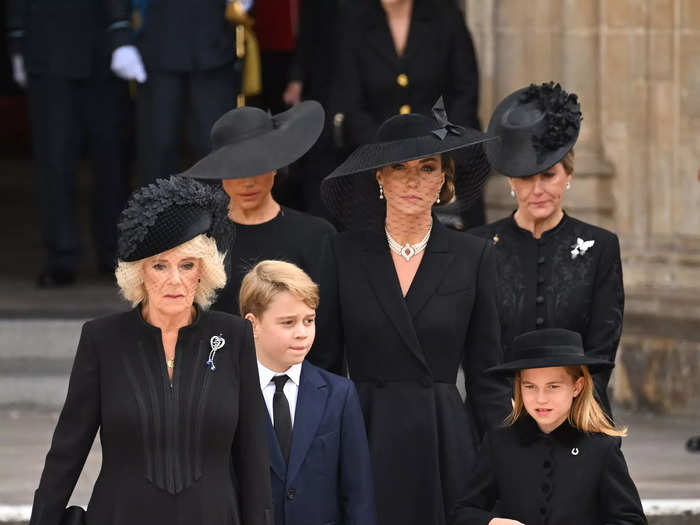 Prince George, on the other hand, wore a navy-blue suit with a black tie.