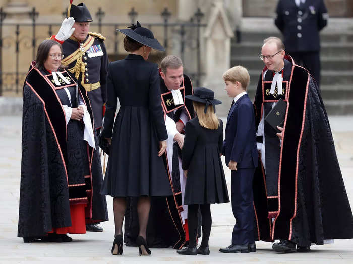 When they arrived at Westminster Abbey, they greeted church officials.