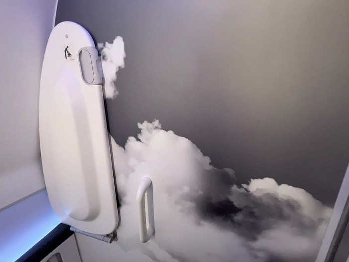 Between sleeping and working, I explored other areas of the jet, including the lavatory. While not very spacious, I liked the creative cloud pattern on the wall. There was also a baby changing table available.