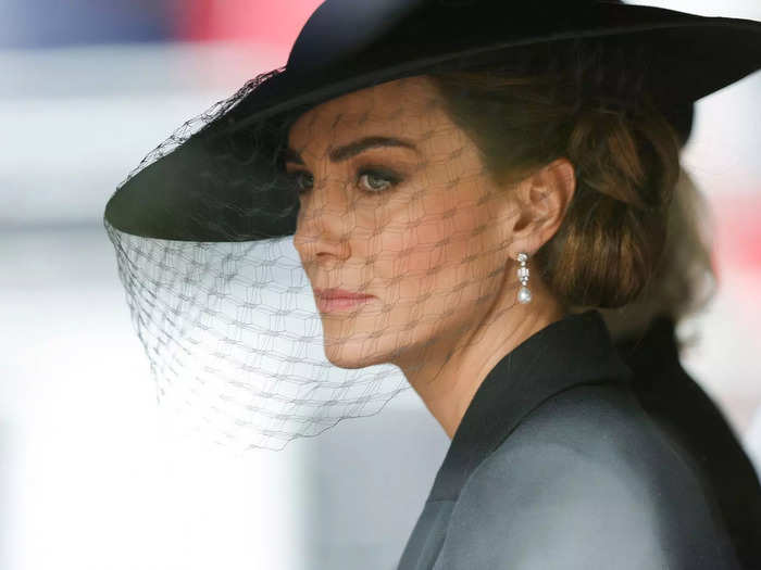 Kate looked out at the crowds of people gathered on the streets of London as she rode behind the procession of the Queen