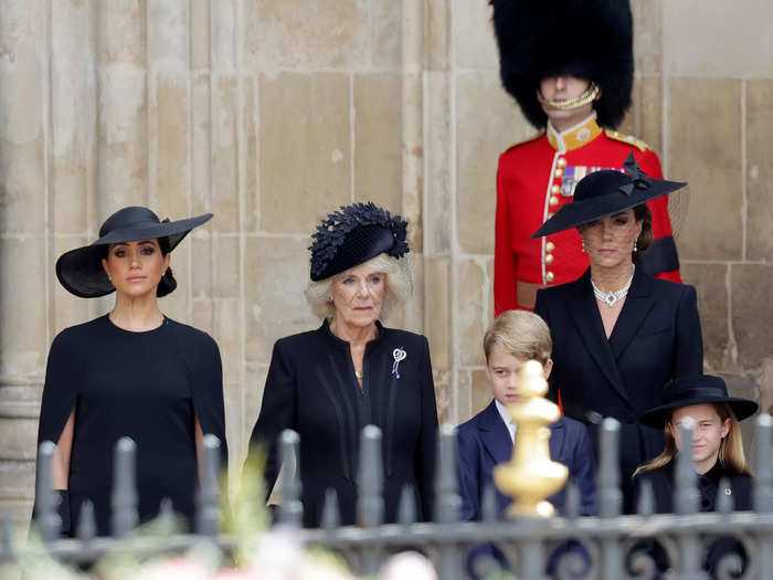 Kate, Camilla, and Meghan stood alongside each other as their husbands walked behind the Queen