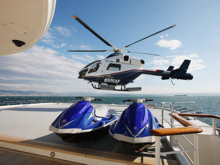 The superyacht includes two helicopter pads, a swimming pool, and a movie theater.