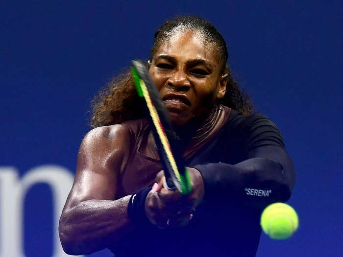 2018: Serena Williams returns the ball during her first-round match at the 2018 US Open.