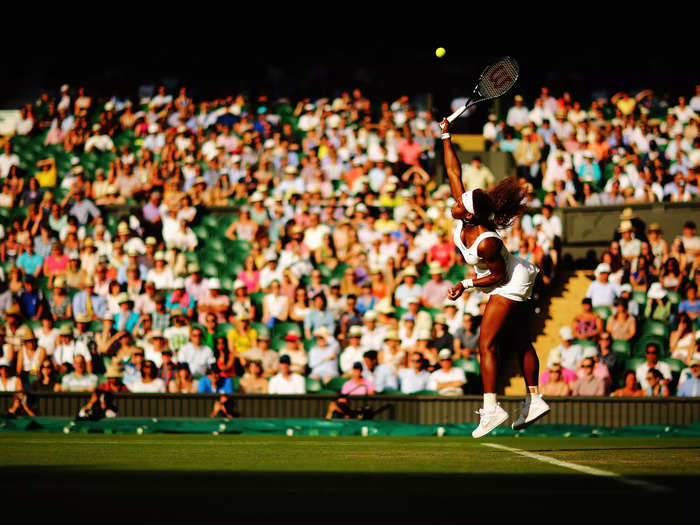 2014: Serena Williams serves during her first-round match at Wimbledon in 2014.