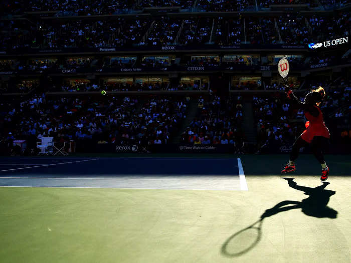 2013: Serena Williams strikes the ball from behind the baseline during her 2013 US Open semifinal match.