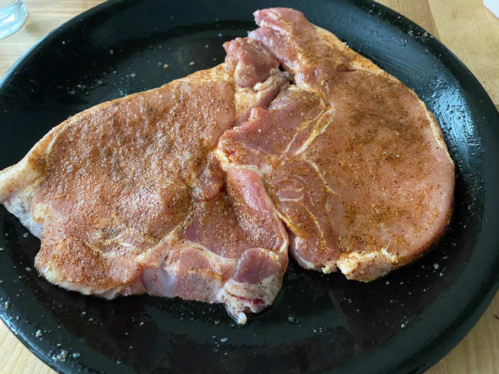 After preheating the air fryer, the chops are ready to start cooking.