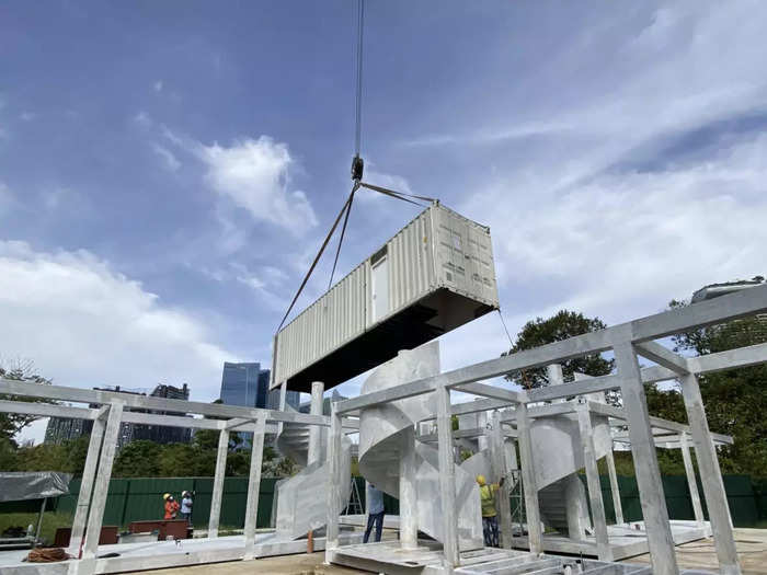 While the complex looks like it was built completely with shipping containers, the first floor is made out of metal that mimics the look of a container.