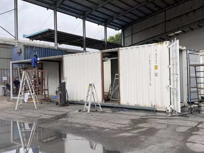 The first step was to make sure the containers were sturdy enough to be transformed into living spaces. At the yard, the containers were cut open and reinforced with steel beams.