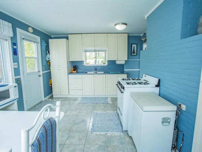 The house features a bright-blue kitchen.