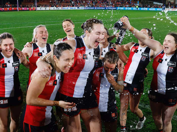 8/27: The St Kilda Saints sing the team song after their round one AFLW win against the Sydney Swans in Sydney, Australia.