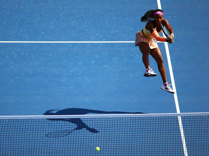 8/13: Coco Gauff hits a shot while playing with her doubles partner, Jessica Pegula, during the National Bank Open in Toronto, Canada.