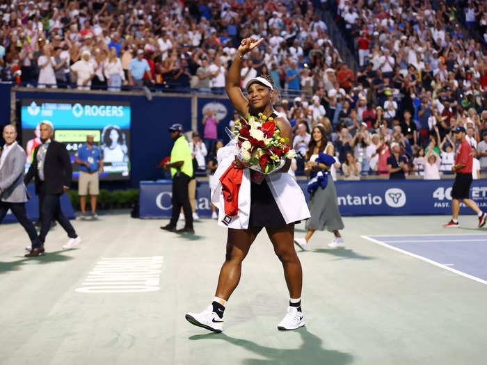 8/10: Serena Williams waves to the crowd as she leaves the court after losing to Belinda Bencic during the National Bank Open in Toronto, Canada.