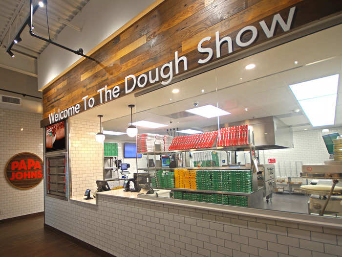 The interior of the store is white and easy to clean, intended to keep customers focused on the "dough show."