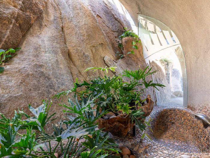 The smaller of the patios has a water feature.