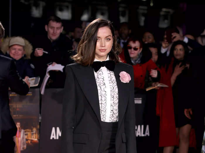 Always one to keep fashion onlookers guessing, de Armas leaned into androgynous chic by wearing a tuxedo with a ruffled undershirt in 2019.