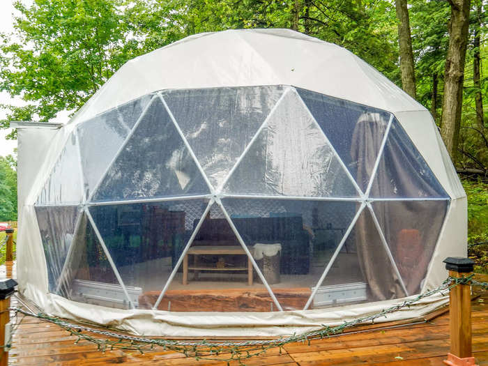 The dome had a massive window on one side, opening up to a wide view of the outdoors. Curtains were provided to cover the window for privacy.