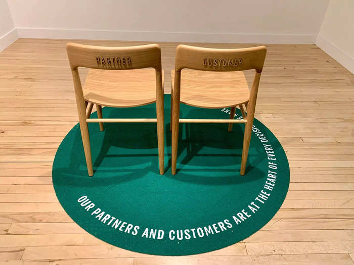 Starbucks CEO and founder Howard Schultz has repeatedly said that company meetings and conferences always have two empty chairs, one for the customer and one for the employee, so those are recreated here.